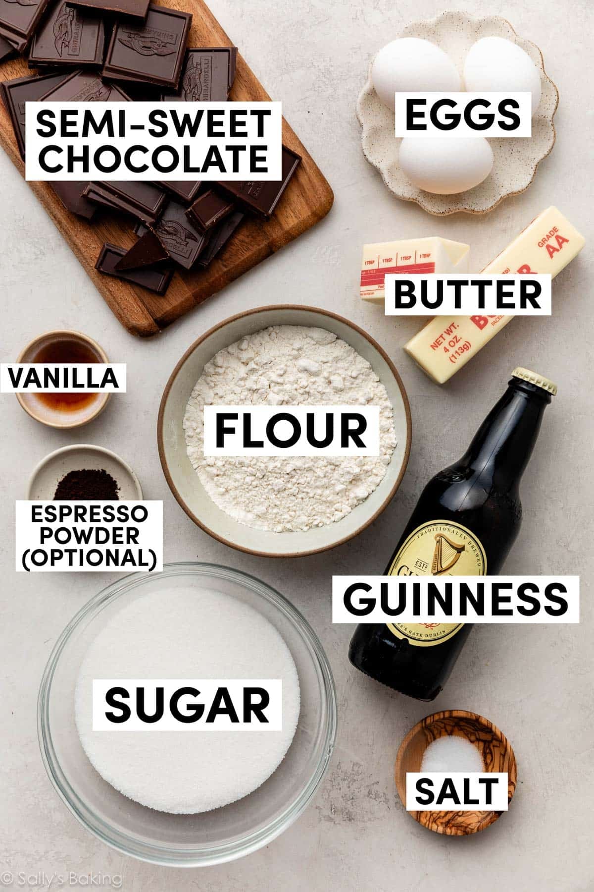 ingredients in bowls including butter, flour, vanilla, salt, sugar, and eggs.