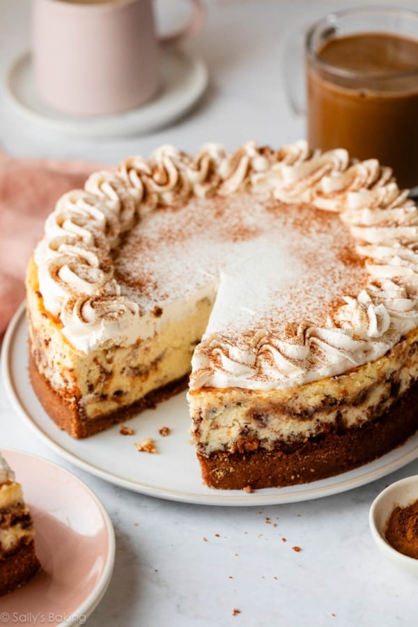 cinnamon swirl cheesecake with whipped cream.