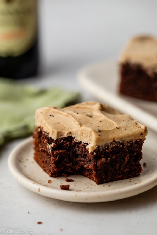 Guinness brownie with Guinness frosting on plate.