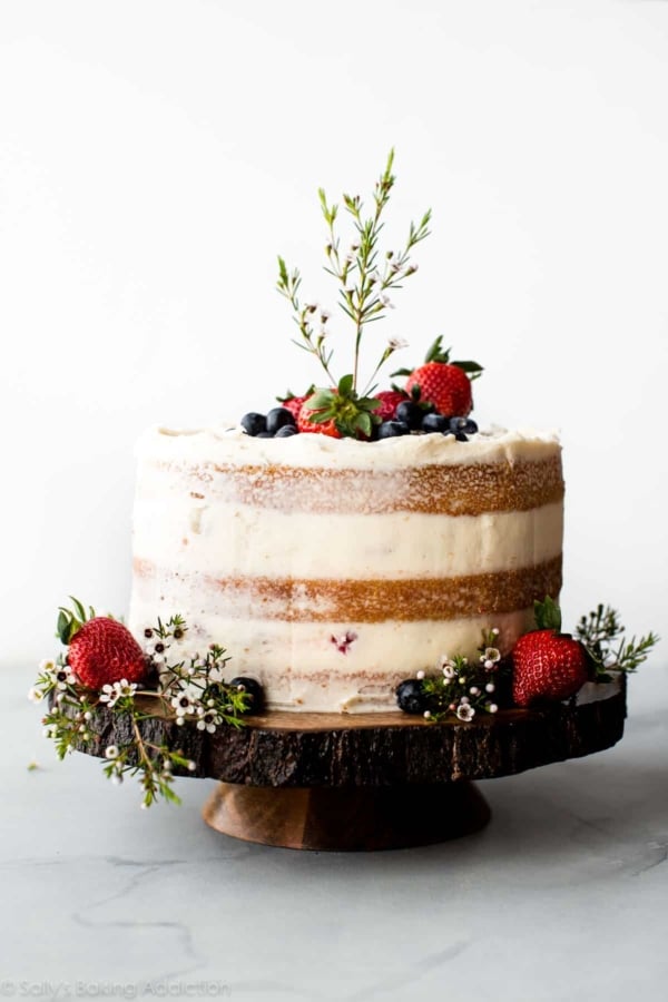 Rustic naked cake on a wood slice cake stand